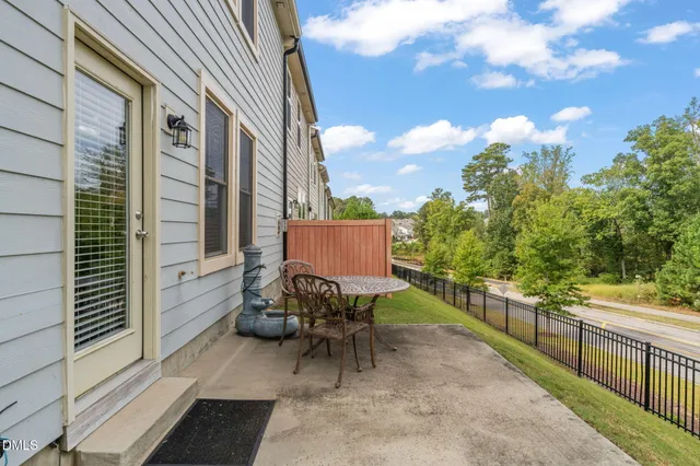 a view of a chair and table in the balcony