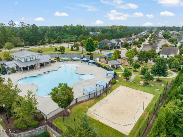 a view of a chair and tables in the patio with a small yard