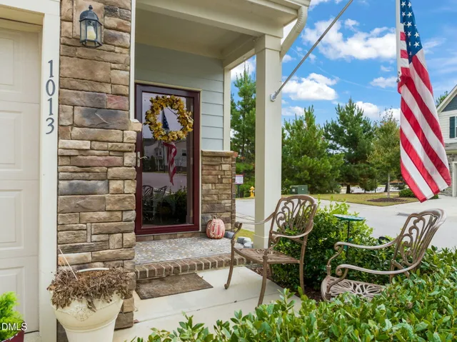 a building outdoor space with patio furniture and potted plants