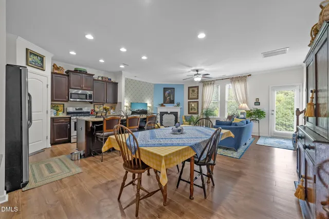 a view of kitchen with dining table and chairs