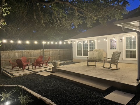 1811 Old Mill Road Cedar Park, TX 78613 - Photo 38 of 39 Illuminated patio and separate seating area create an inviting backyard retreat.