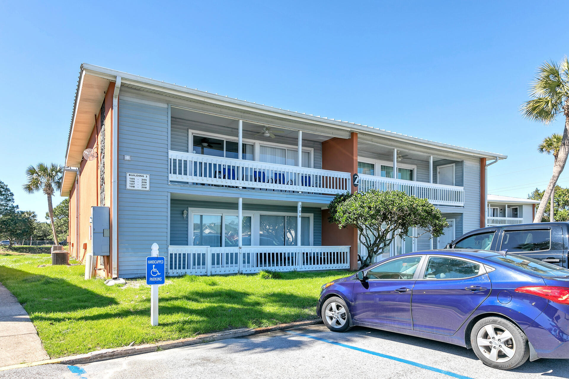 Undisclosed Address Destin, FL 32541 - Photo 1 of 23 a front view of a house with garden
