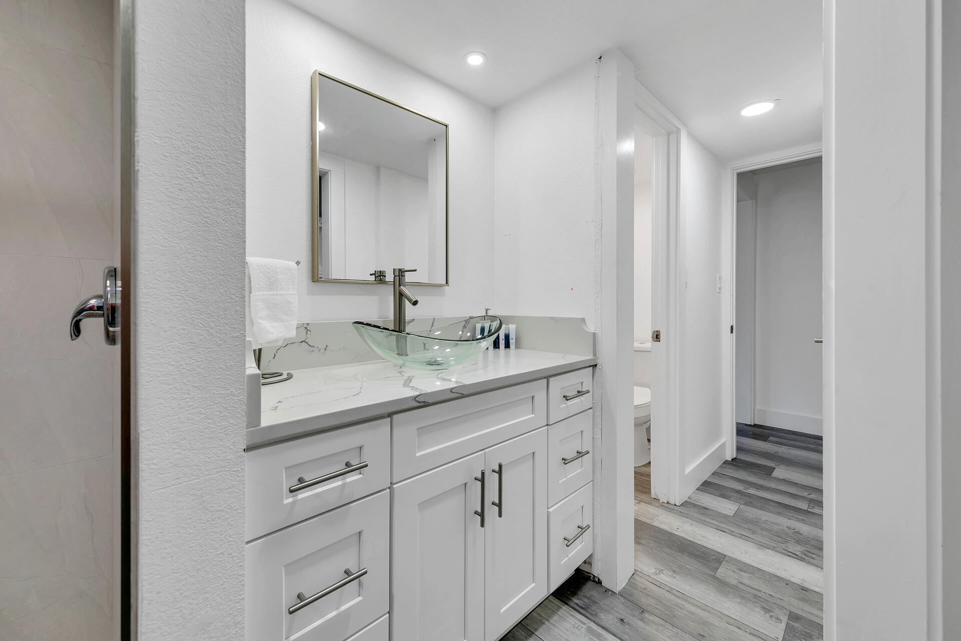 Undisclosed Address Destin, FL 32541 - Photo 17 of 23 a bathroom with a double vanity sink and mirror