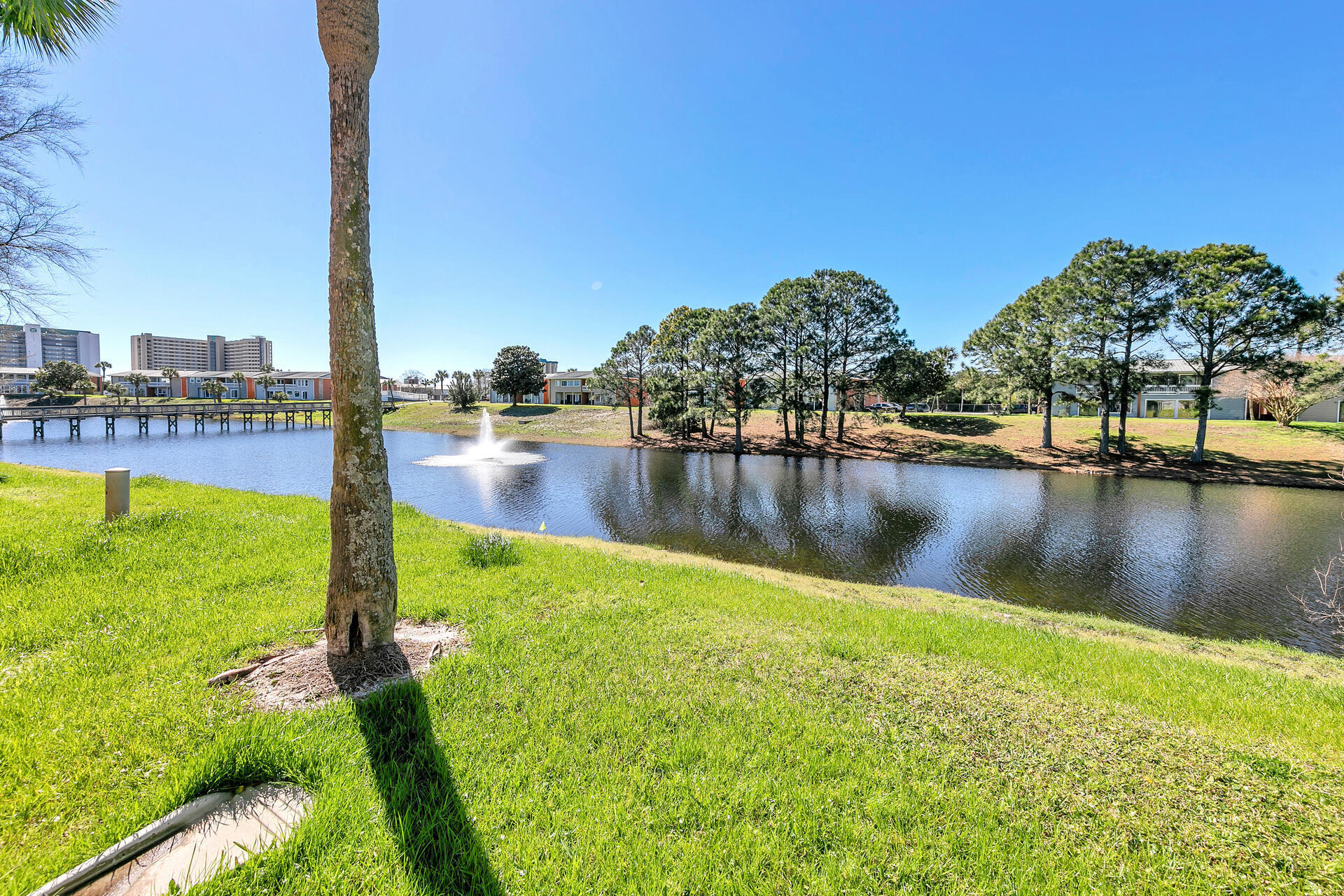 Undisclosed Address Destin, FL 32541 - Photo 23 of 23 a view of a lake with houses in the back