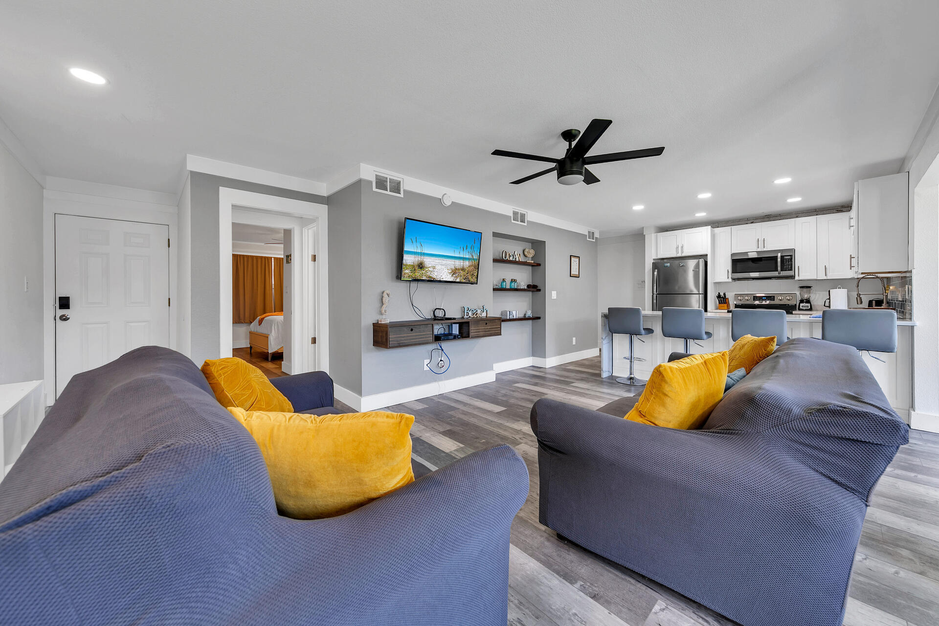 Undisclosed Address Destin, FL 32541 - Photo 4 of 23 a living room with furniture kitchen view and a chandelier