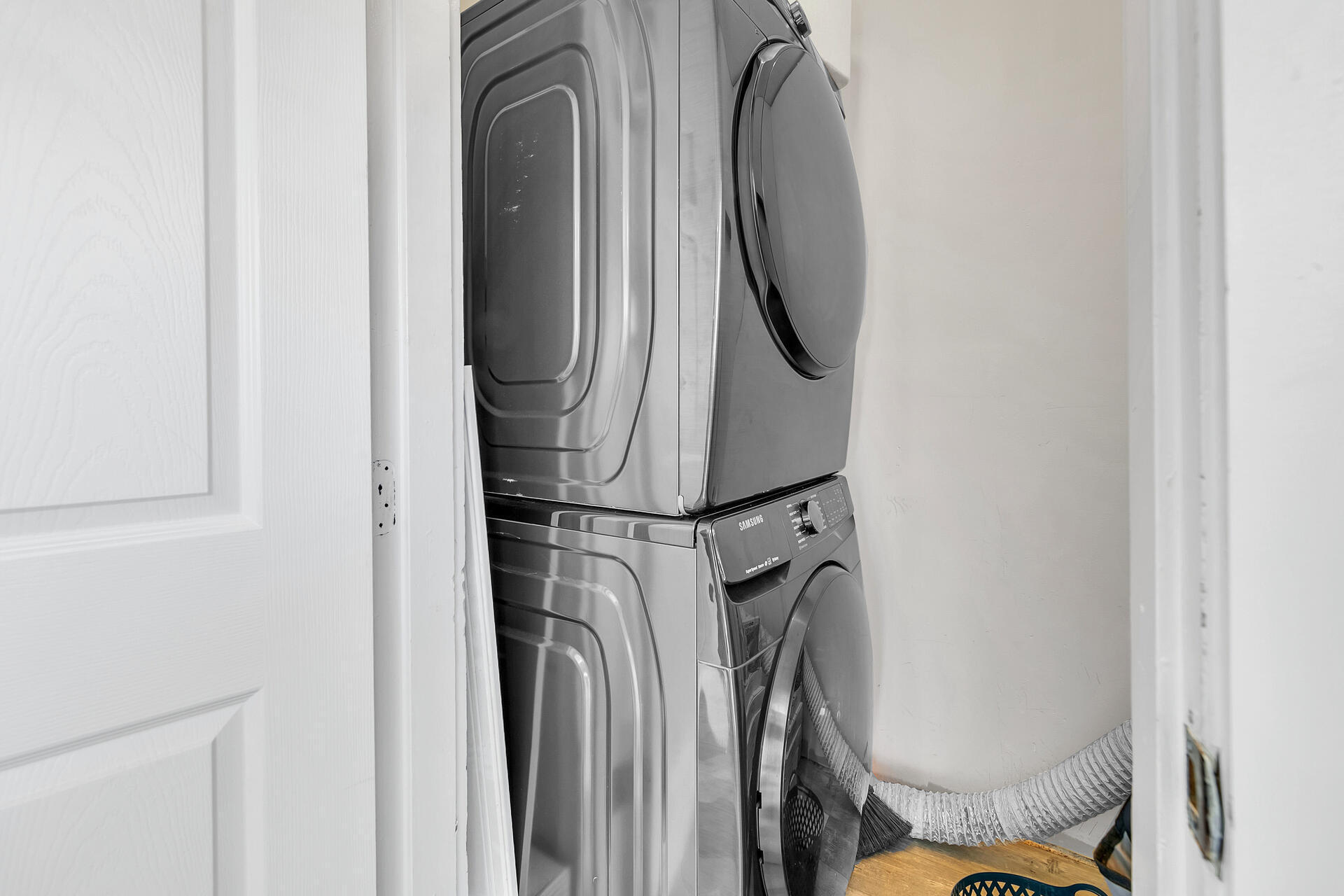 Undisclosed Address Destin, FL 32541 - Photo 9 of 23 a close view of walk in closet with clothes