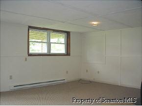 15 Washington Park Road Tunkhannock, PA 18657 - Photo 5 of 5 an empty room with a workbench