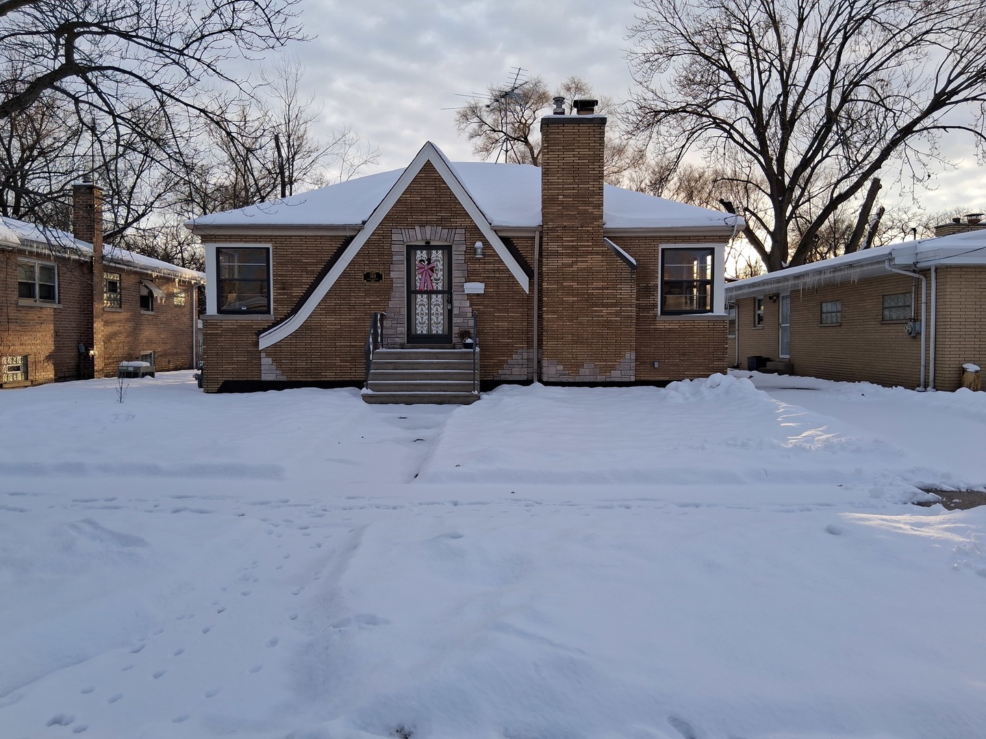front view of a house with a yard