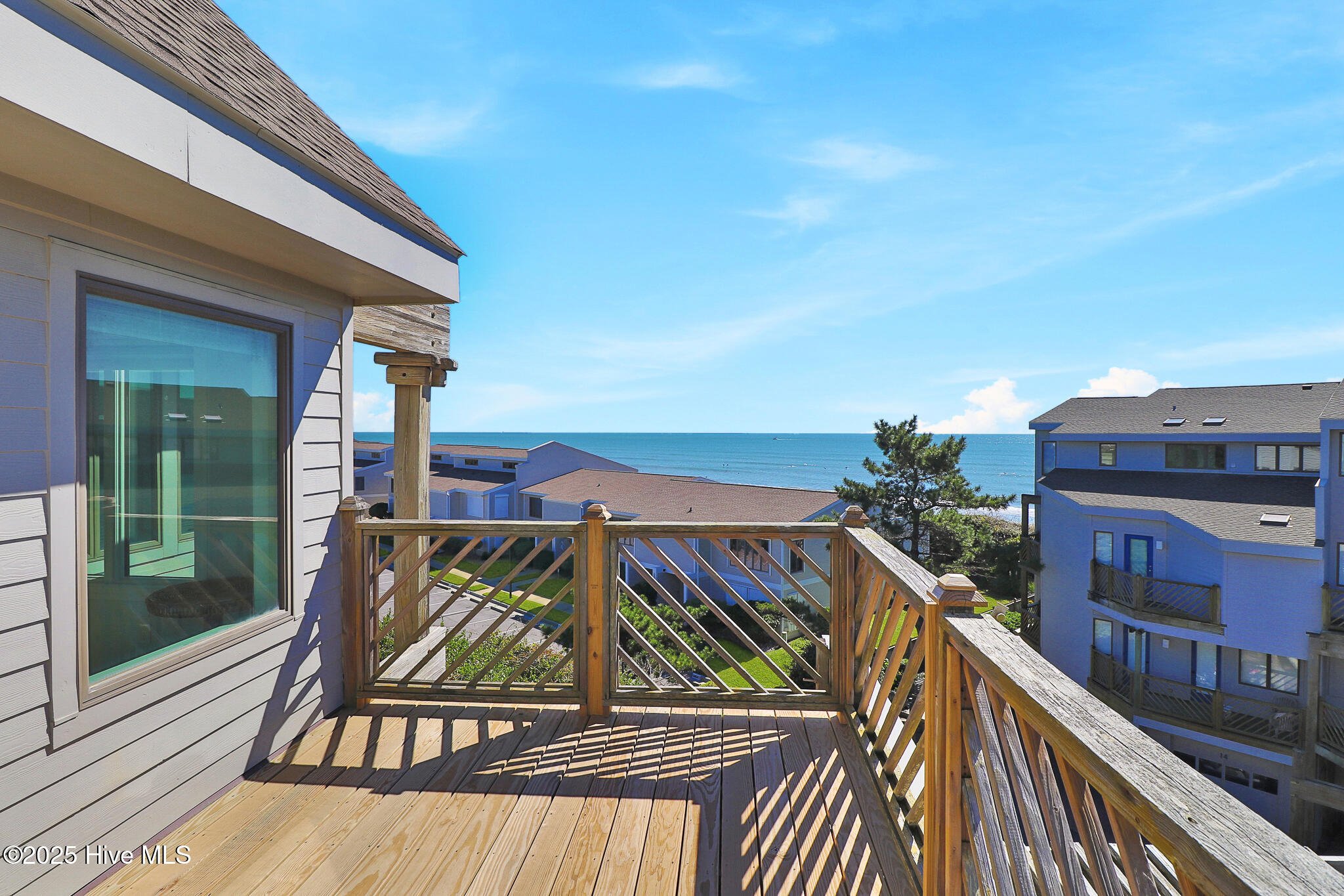 301 Salter Path Road, Unit 12 GENESIS Pine Knoll Shores, NC 28512 - Photo 9 of 47 Deck off second floor bedroom