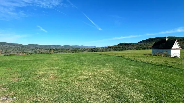 a view of an ocean and a mountain