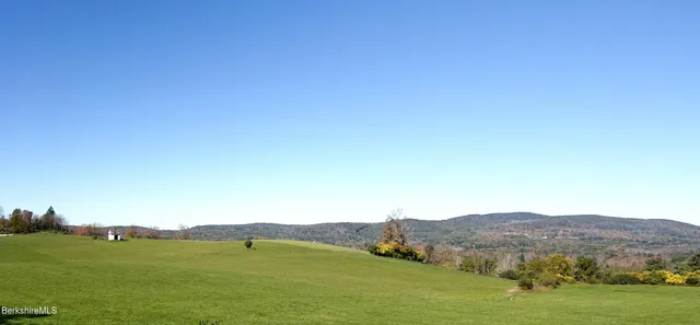 a view of a field with an outdoor space
