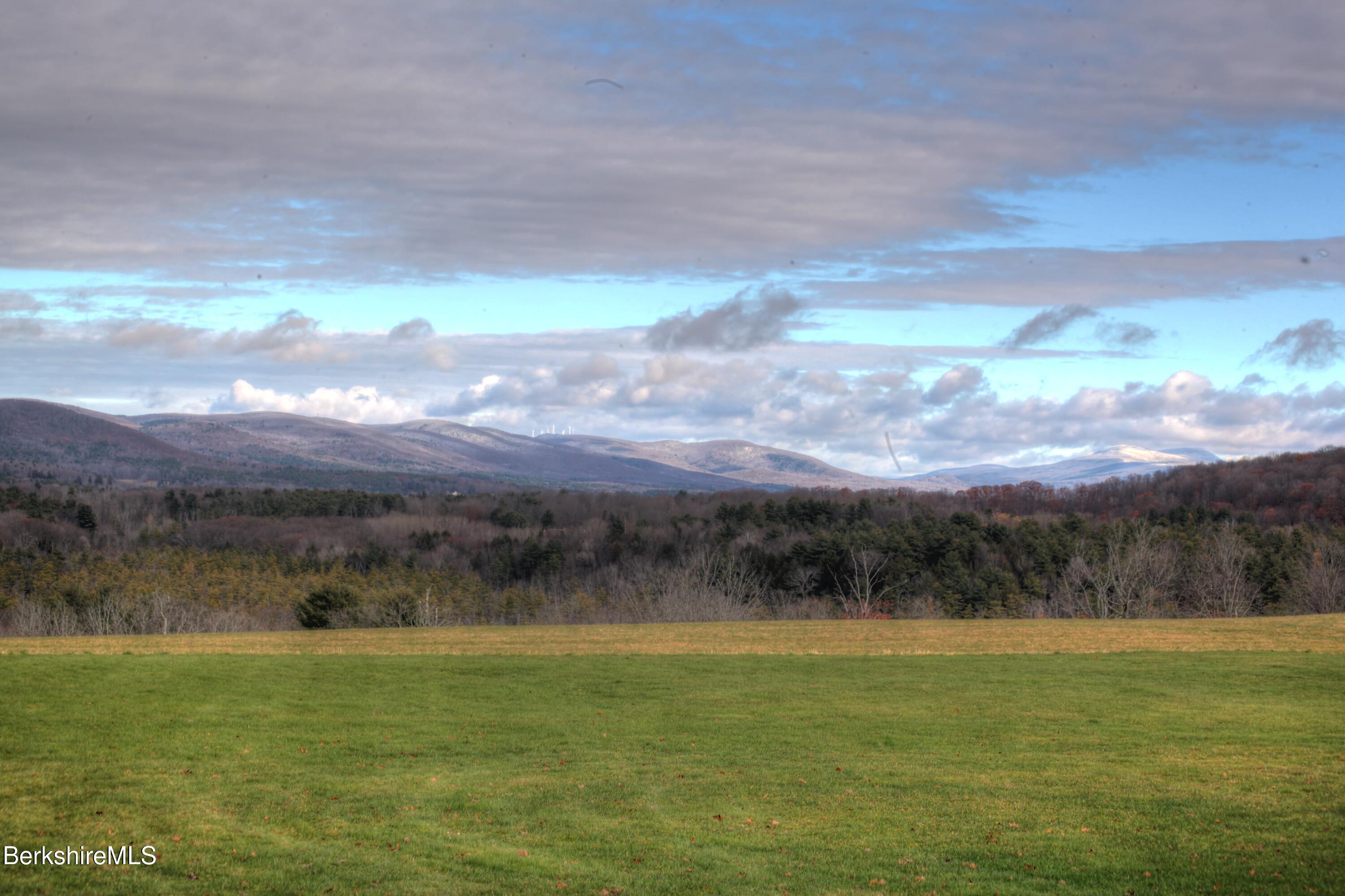 1130 E Road Richmond, MA 01254 - Photo 24 of 53 a view of a lake with a mountain