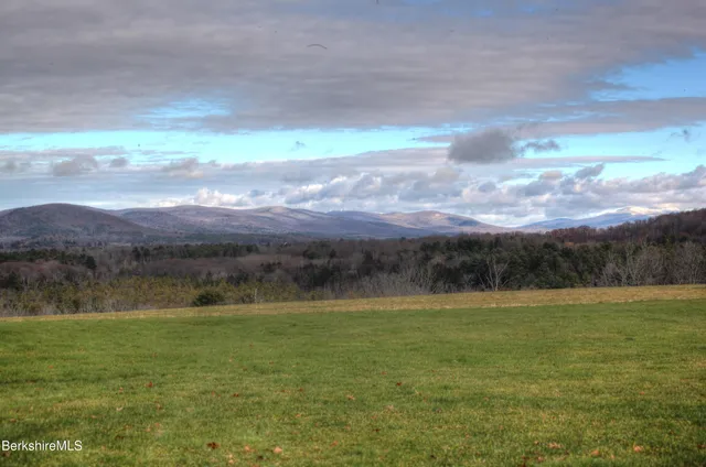 a view of a lake with a yard