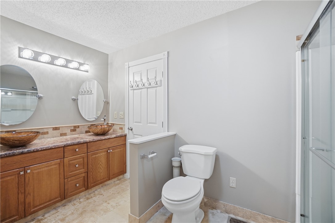 1208 Jarva Lane Springboro, OH 45066 - Photo 34 of 75 This bathroom features dual vanity sinks and a separate toilet area for added convenience.