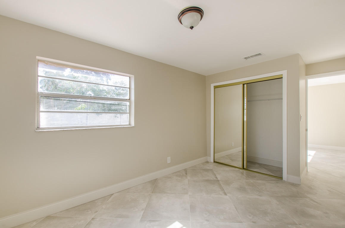 22710 Family Circle Boca Raton, FL 33428 - Photo 21 of 28 a view of an empty room with a window