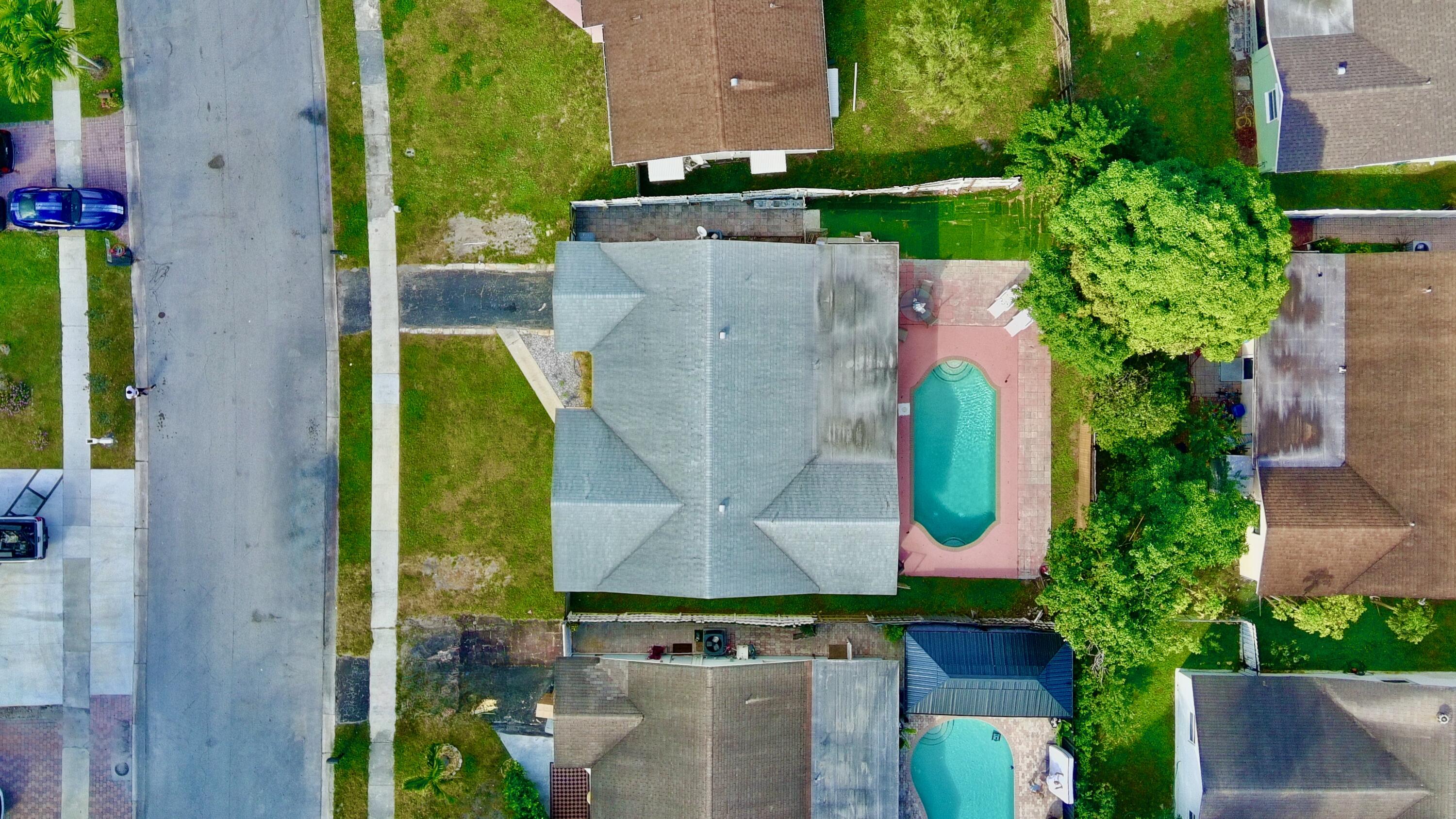 22710 Family Circle Boca Raton, FL 33428 - Photo 4 of 28 an aerial view of residential house with outdoor space and swimming pool