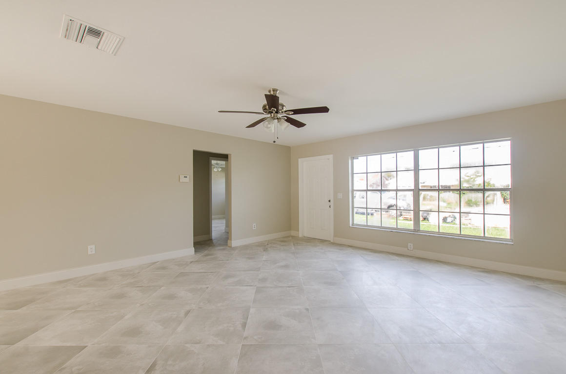 22710 Family Circle Boca Raton, FL 33428 - Photo 9 of 28 a view of an empty room with a window