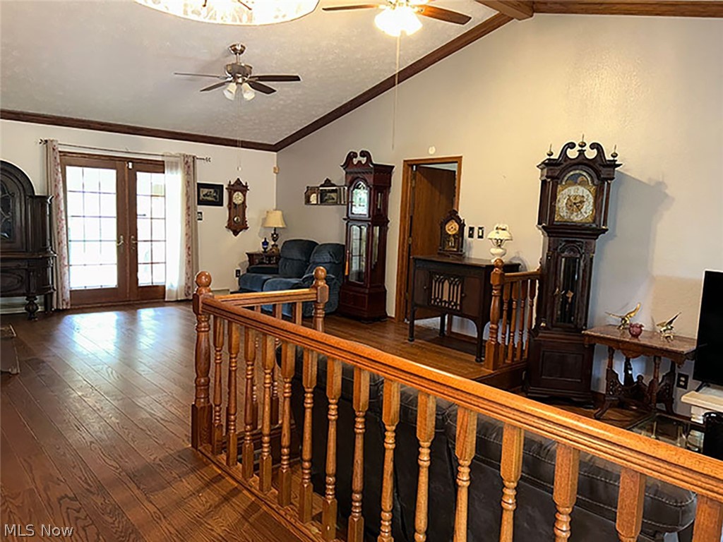 14987 Strader Road East Liverpool, OH 43920 - Photo 8 of 13 Hall with crown molding, french doors, lofted ceiling, and hardwood / wood-style floors
