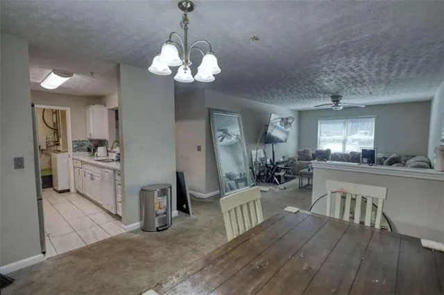 a very nice looking dining room with a large window