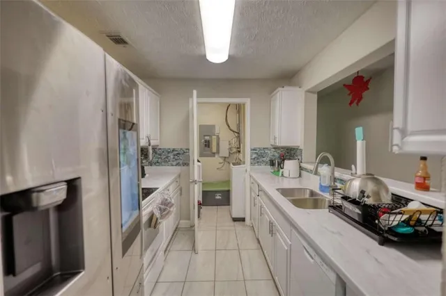 a large kitchen with a lot of counter space and a sink