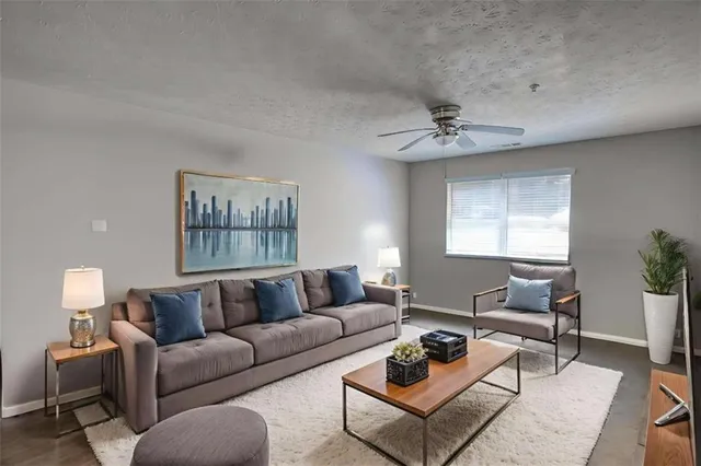 a living room with furniture and a window