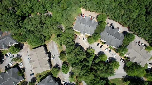 an aerial view of a house with a yard and garden