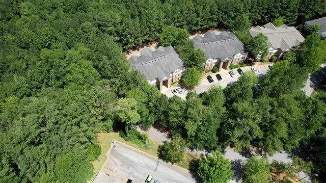 an aerial view of a house with yard