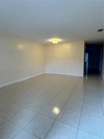 a view of an empty room with a sink