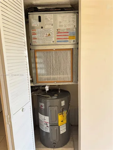a utility room with washer and dryer