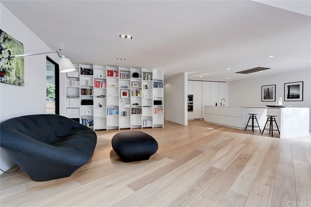 4413 Grimes Place Encino, CA 91316 - Photo 11 of 26 a living room with furniture and a wooden floor