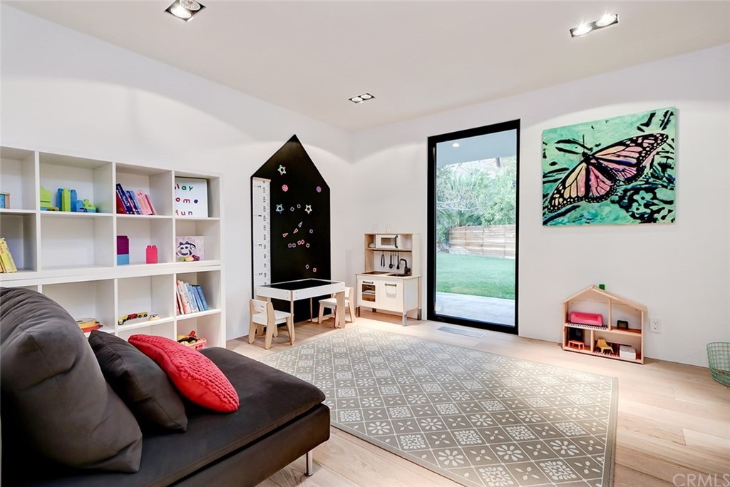 4413 Grimes Place Encino, CA 91316 - Photo 16 of 26 a bedroom with furniture and a bed