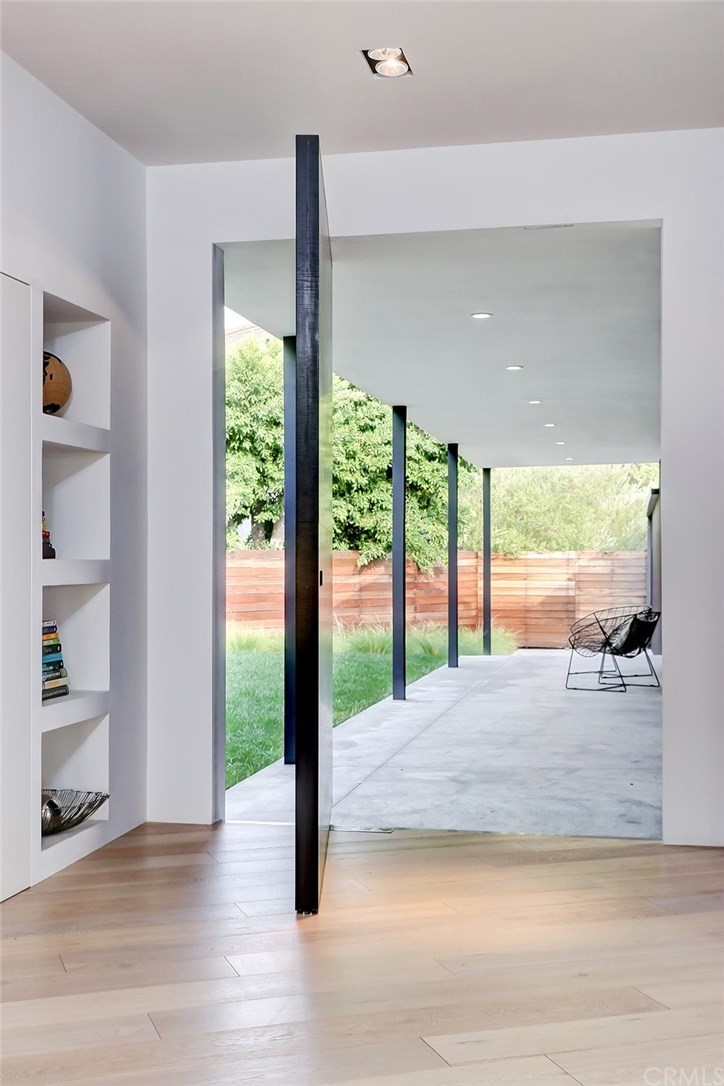 4413 Grimes Place Encino, CA 91316 - Photo 3 of 26 a view of an empty room with wooden floor and a window