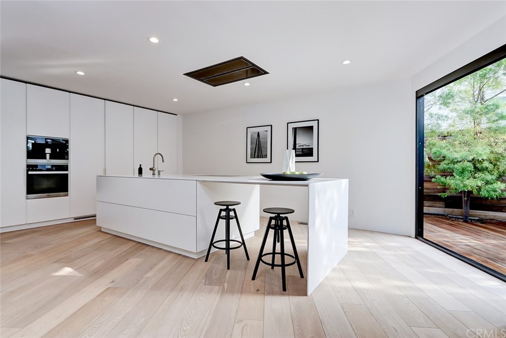 4413 Grimes Place Encino, CA 91316 - Photo 6 of 26 a spacious bathroom with a sink a large mirror and a shower