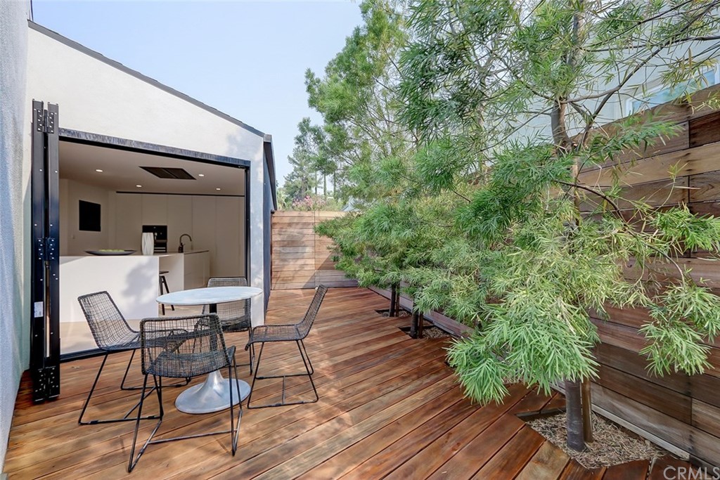 4413 Grimes Place Encino, CA 91316 - Photo 8 of 26 a view of a house with backyard and sitting area