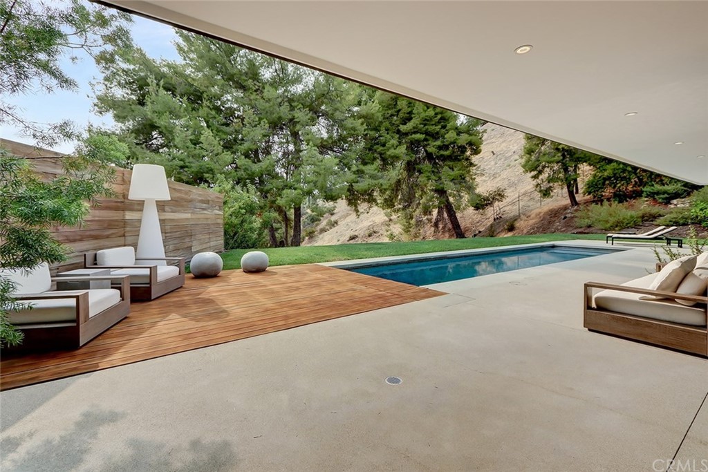 4413 Grimes Place Encino, CA 91316 - Photo 9 of 26 a view of a patio with a yard
