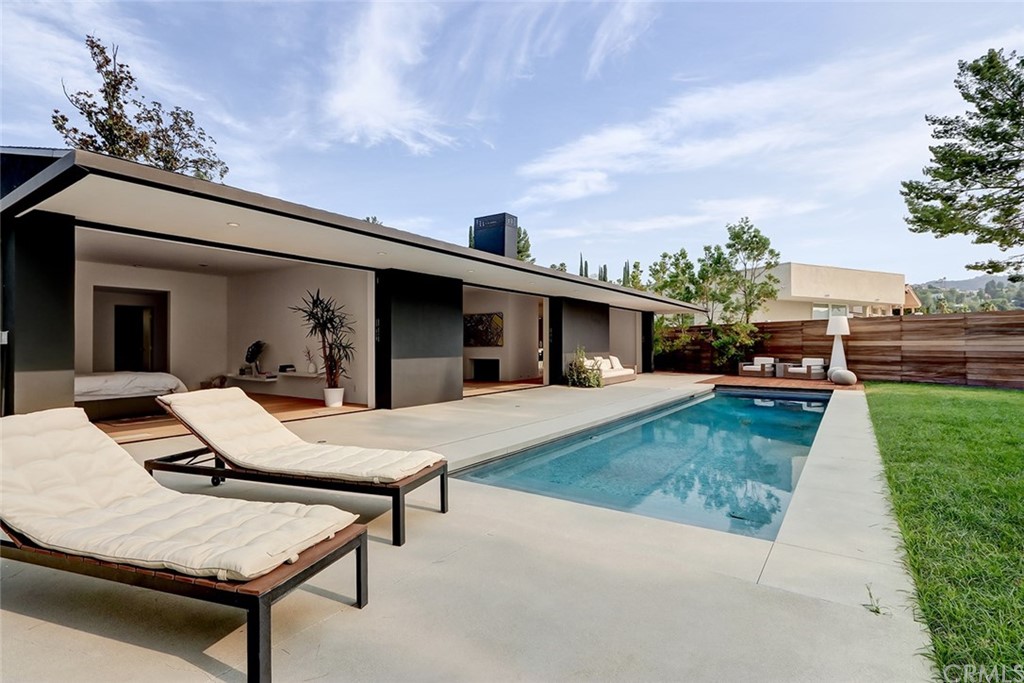 4413 Grimes Place Encino, CA 91316 - Photo 10 of 26 a view of a patio with table and chairs with a barbeque grill and plants