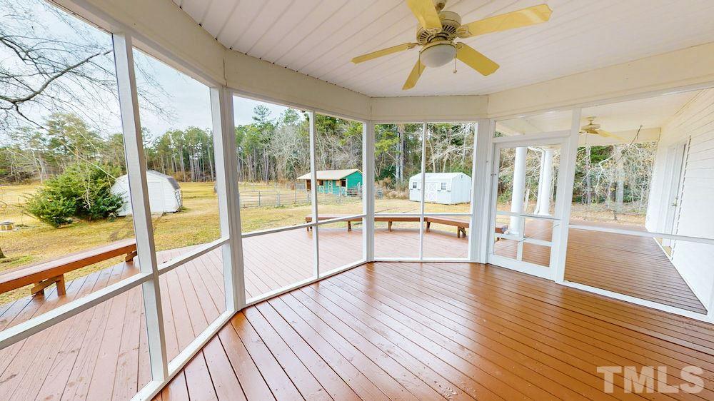 1560 Beasley Road Benson, NC 27504 - Photo 22 of 27 a view of an entryway with wooden floor and fence