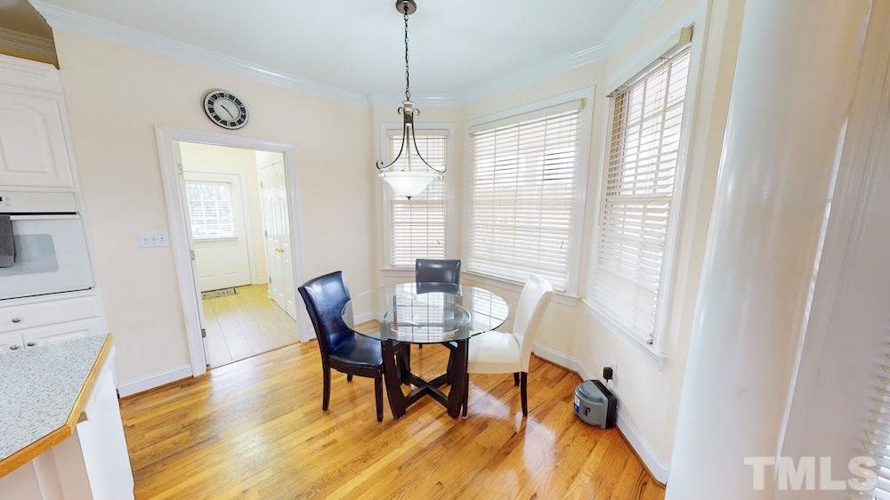 1560 Beasley Road Benson, NC 27504 - Photo 9 of 27 a view of a dining room with furniture window and wooden floor