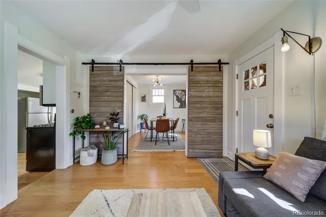 a living room with furniture and a table