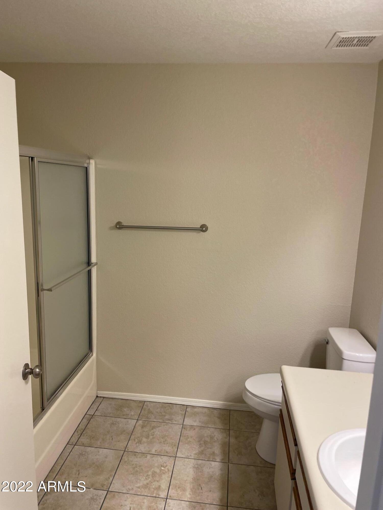 1444 North Recker Road, Unit 167 Mesa, AZ 85205 - Photo 7 of 13 a bathroom with a toilet