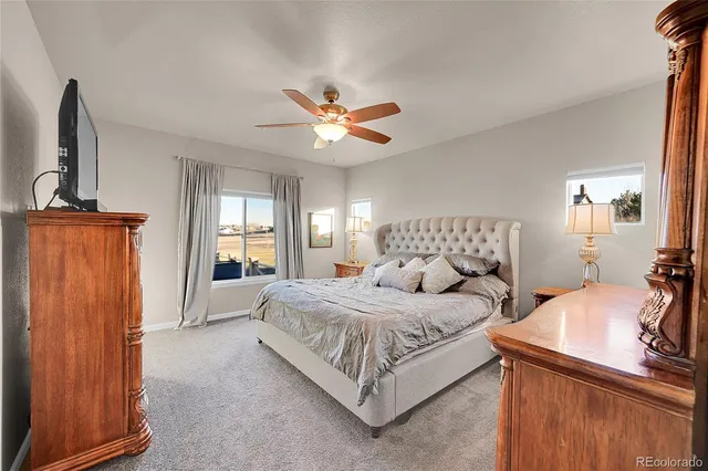 a bedroom with furniture and a chandelier