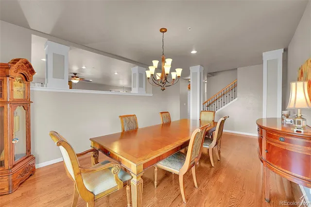 a view of a dining room with furniture and wooden floor