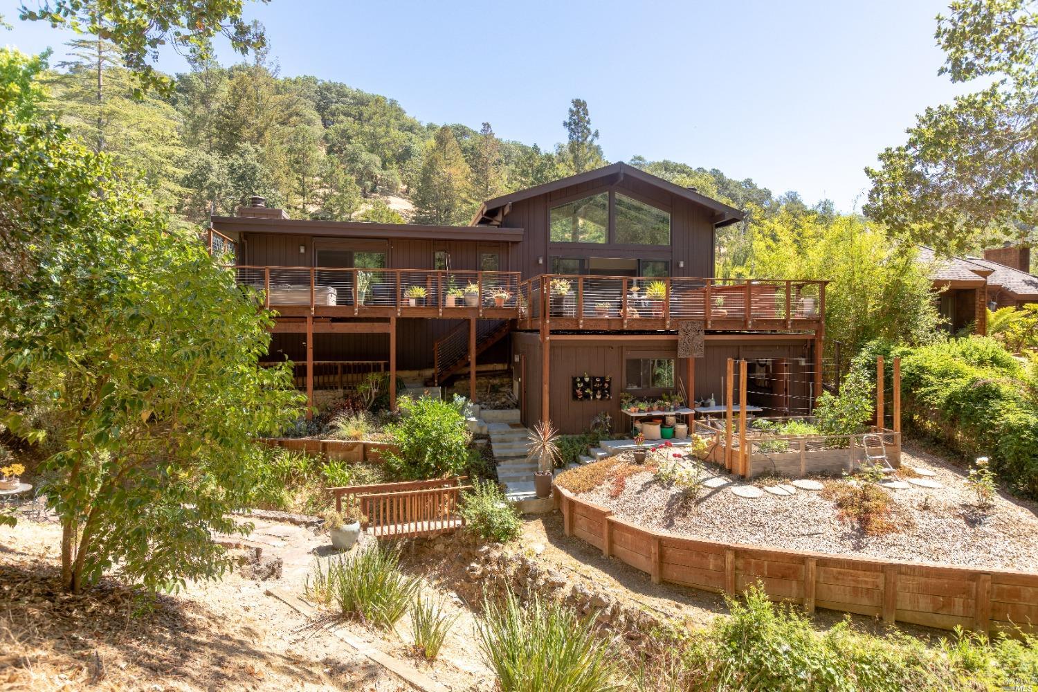 a view of a house with a fountain in a patio