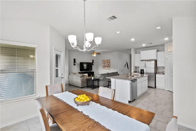 a view of a dining room kitchen and dining room
