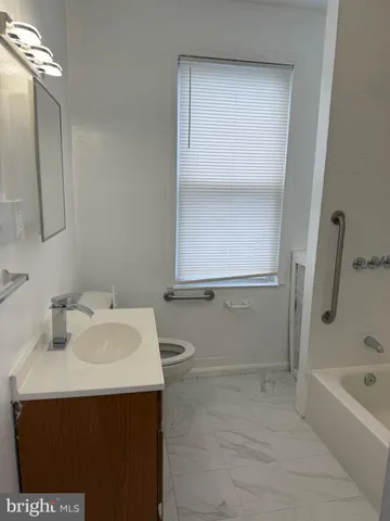 a bathroom with a sink and a bathtub