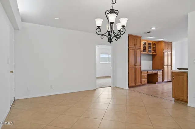 a kitchen with stainless steel appliances a refrigerator sink and cabinets