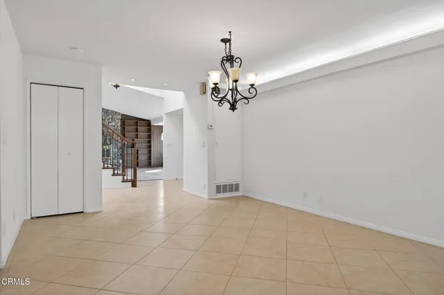 a kitchen with stainless steel appliances a refrigerator sink stove microwave and cabinets