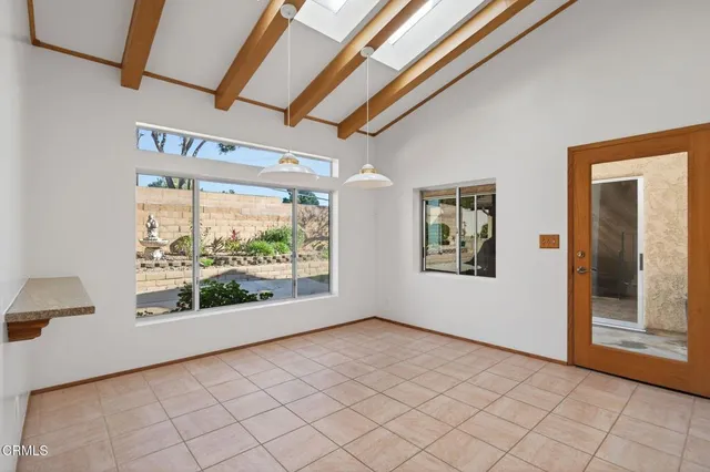 a view of a kitchen with furniture and a ceiling fan