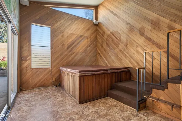 a view of a chairs and table in a backyard