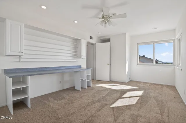 an aerial view of multiple houses with yard